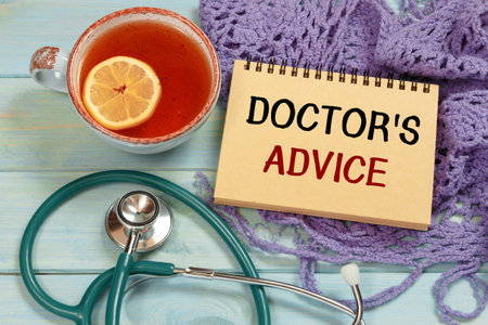 Notepad with the inscription DOCTOR'S ADVICE and stethoscope. Medical concept.の写真素材