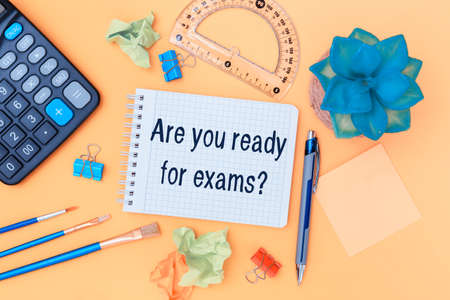 Open notebook with school supplies. Inscription Are you ready for examsの写真素材