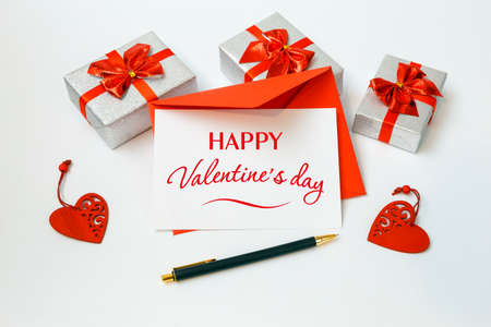 Valentine's day card with red envelope and gifts on white backgroundの写真素材