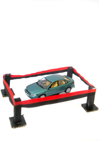 A light blue car in a safe area, isolated on white.の写真素材