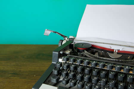 Detail of an old retro typewriter and blank paperの写真素材