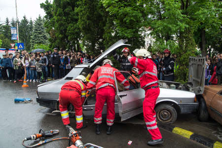Firefighters extractic a victim from car accident - Romanian National Emergency Exerciseのeditorial素材