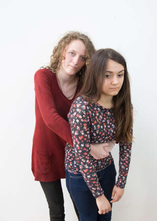 A young women learning how to do the Heimlich maneuver which is used in case of choking.の写真素材