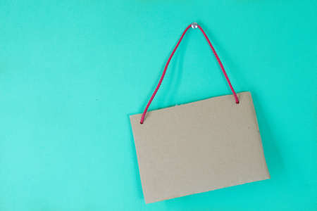 Vintage sign. Cardboard sign with copyspace on retro green background.の写真素材
