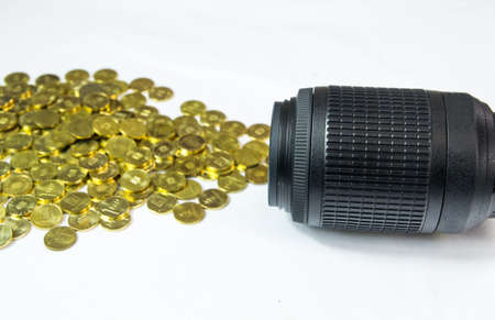Pile of money getting out of DSLR lens. Photographer profession conceptの写真素材