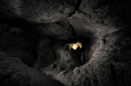 dark cave with man の写真素材