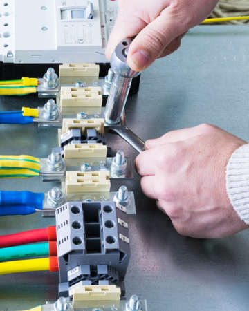 mounting electrical components on the circuit Board in the electrical Cabinetの写真素材