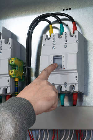 people hand off auto switch mounted in electrical Cabinet