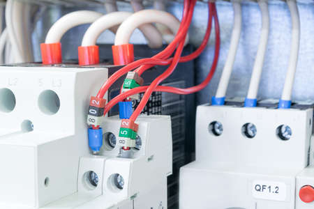 On the mounting panel in the electrical Cabinet there are installed circuit breakers protect the motor. Circuit breakers protect motors connected by wires with the terminals and marking.の写真素材