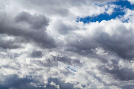 A large Cumulus cloud in the blue sky. A bright Sunny day.の写真素材
