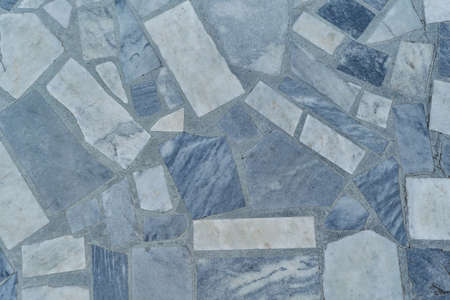 The surface of the floor or wall is made of marble tiles in the form of rectangle. The surface is smooth and even. Rectangle tiles of different size and color. Texture, background or backdrop.の写真素材