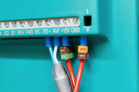 Connecting the electrical wires to the rear panel. Connection of cables according to the scheme. The markings on the wires. Modern equipment for automation and remote control.の写真素材
