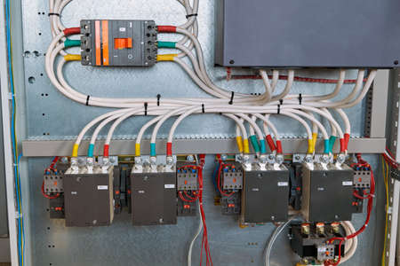 Four magnetic starters, a power circuit breaker and other electrical equipment are connected by...