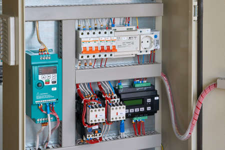 Controller for remote control, circuit breakers, magnetic starters, control relay, power supply, socket, thermostat in the electrical Cabinet. Engine or pump control Cabinet. Assembly, inspection.の写真素材