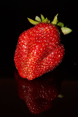 The first strawberry of 2020 from its garden.の写真素材