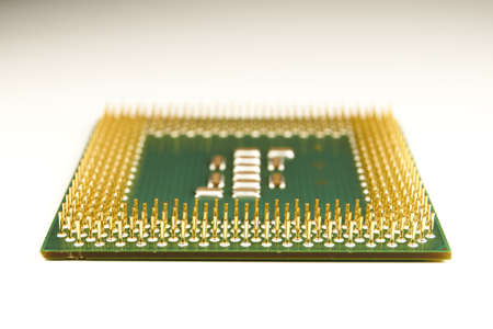 CPU. An old processor of 2001 release P III-800 on a white background. Focus in the foreground....