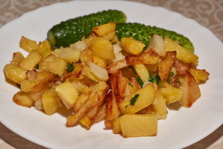 Fried potatoes with green onions and spices. close-up.の写真素材