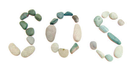 some pebble in the form of word SOSの写真素材