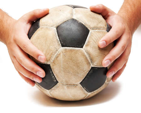 hands on the soccer ball on whiteの写真素材