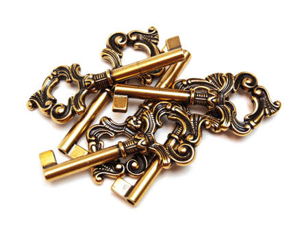 old-fashioned keys isolated on whiteの写真素材