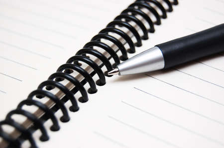 stripped notepad with penの写真素材