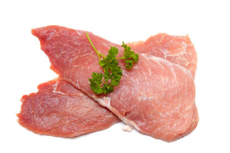 Several pieces of meat with parsley isolated on whiteの写真素材