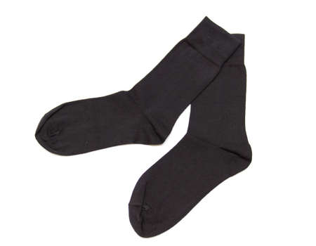 pair of black socks isolated on white background の写真素材