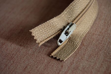 Brown zipper on a clothの写真素材