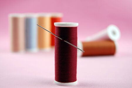 Colorful threads with a sewing needle
