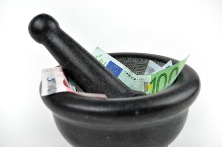 Euro banknotes in gray mortarの写真素材