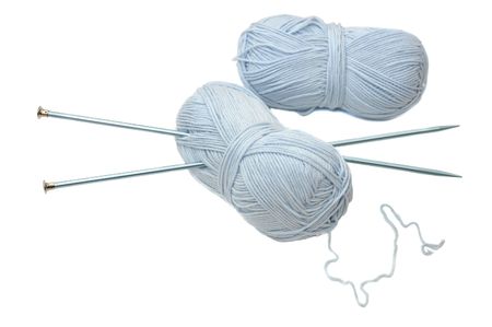 Blue wool with knitting needles, isolated on white