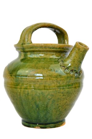 Green old jar isolated on whiteの写真素材