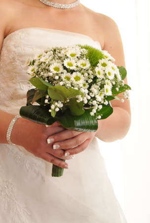 Bride with a white bridal bouquetの写真素材