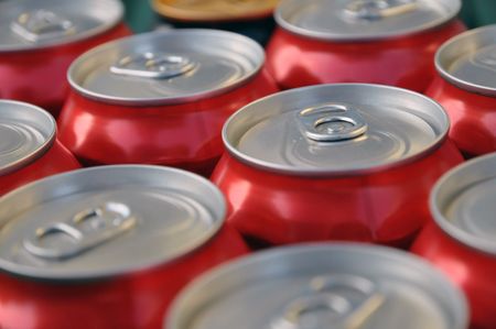 Many red cans of soda or beerの写真素材