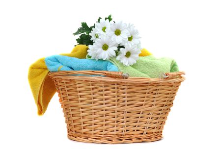 Bouquet of fresh daisies on a pile of fresh towelsの写真素材