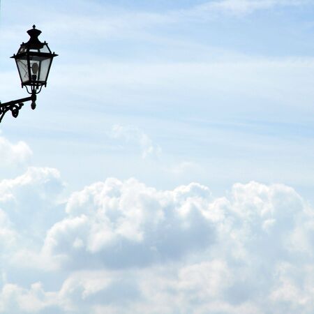 Old lamp above the lovely blue skyの写真素材