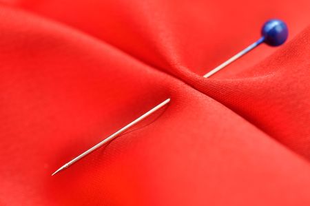 Straight pin in a red satinの写真素材