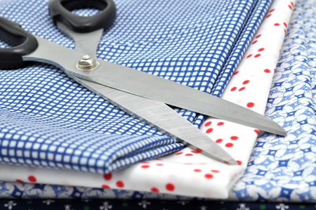Scissors on a pile of folded textile