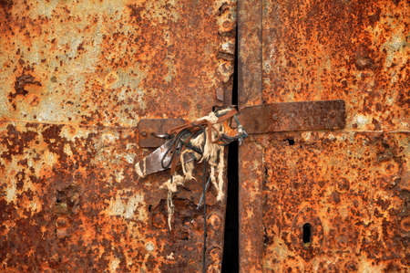 Old rusty bolt on grunge doorの写真素材