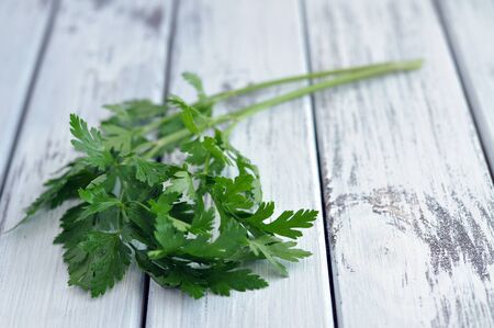Fresh parsley on an old white table