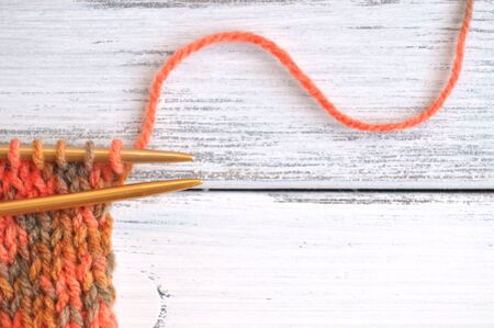Knitting with yarn in autumn colors