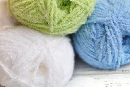 Three skeins of colorful yarn