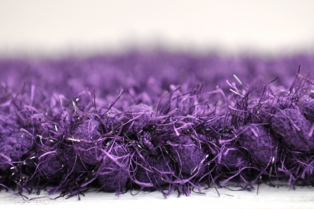Purple pom pom eyelash yarn knit frameの写真素材