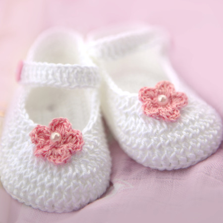 Handmade crochet christening bootiesの写真素材