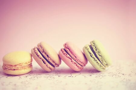 Colorful macaroons in a line on pinkの写真素材