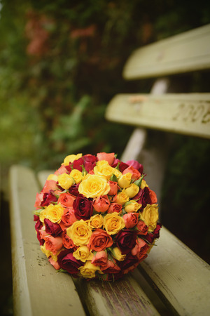 Bridal bouquet on bench closeupの写真素材