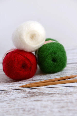 Knitting for Christmas with red, green and white yarnの写真素材