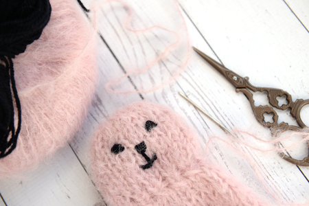 Making soft baby toy with yarnの写真素材