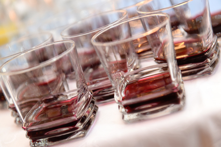Glasses with spirits on a reception tableの写真素材