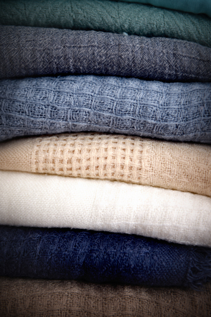 Stack of different color knitwearの写真素材